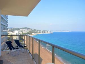 two chairs sitting on a balcony overlooking the ocean at President B-14 in Platja d'Aro