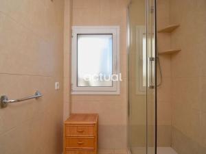 a bathroom with a glass shower and a window at President B-14 in Platja d'Aro +27 photos