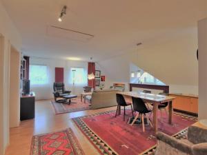 a large living room with a table and chairs at Ferienwohnung Kobs in Ausacker
