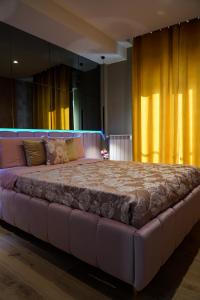Ένα ή περισσότερα κρεβάτια σε δωμάτιο στο Maison Lion Luxury