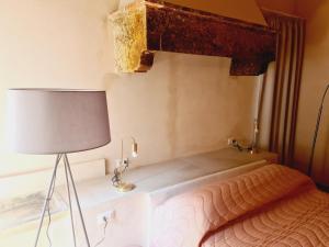 Postel nebo postele na pokoji v ubytování Allegra Toscana - Affittacamere Guest house Arezzo