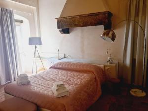 Postel nebo postele na pokoji v ubytování Allegra Toscana - Affittacamere Guest house Arezzo