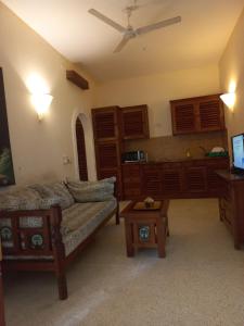 a living room with a couch and a table at Azuri Homes Malindi, Stylish 1 bedroom beach front villa in Malindi