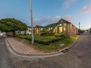 a house sitting on the side of a street at Lilla-Bett Self Catering Accommodation Mossel Bay in Mossel Bay