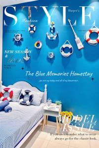 a poster for a blue memories nursery with a bed at The Blue Memories Homestay (Mediterranean Style) in Sungai Pelik