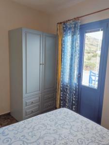 Postel nebo postele na pokoji v ubytování Agios Nikolaos Sea Side Apartments