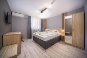 Postel nebo postele na pokoji v ubytování Park Hotel Ambrózia