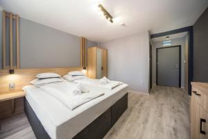 Postel nebo postele na pokoji v ubytování Park Hotel Ambrózia