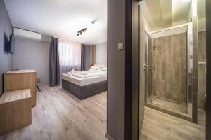 Postel nebo postele na pokoji v ubytování Park Hotel Ambrózia