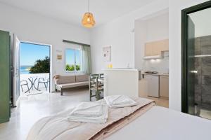Posteľ alebo postele v izbe v ubytovaní Eolos Apartments