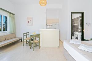 Posteľ alebo postele v izbe v ubytovaní Eolos Apartments