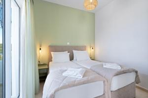 Posteľ alebo postele v izbe v ubytovaní Eolos Apartments