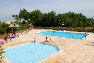a group of people playing in a swimming pool at Azureva Sigean in Sigean