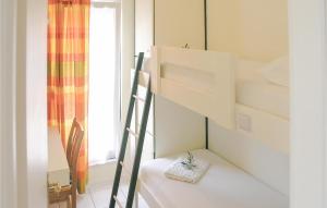 a room with a bunk bed with a ladder and a window at Soleiliosonne Haus Zeus in Ermioni