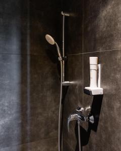 a shower with a shower head in a bathroom at Phoenix7 in Mödling