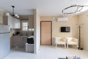 Η κουζίνα ή μικρή κουζίνα στο AIOLOS COZY alimos center APARTMENT near the sea +4 φωτογραφίες