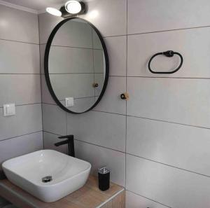 a white bathroom with a sink and a mirror at Happy Home in Leonidio +43 photos