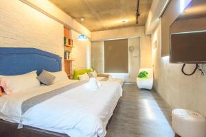 Ein Bett oder Betten in einem Zimmer der Unterkunft 綠寶石休閒農場 其他房型請加Line