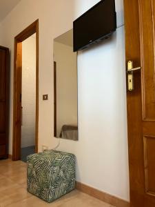 TV a/nebo společenská místnost v ubytování Apartamento LB, vistas a la ría