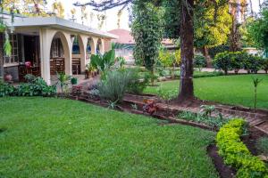 a garden in front of a house at Kiwavi Home in Moshi