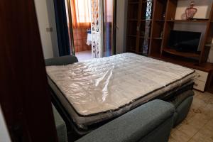 Postel nebo postele na pokoji v ubytování L'isola Che Non C'è