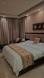 a bedroom with a large bed in a room at فندق مرسى جيزان in Jazan