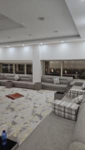a living room with couches and tables in a building at فندق مرسى جيزان in Jazan