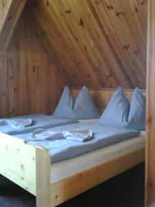 A bed or beds in a room at Pension Svoboda