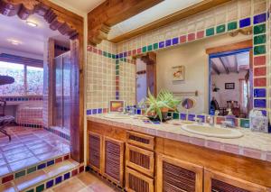 a bathroom with a sink and a shower at Loba Luna-Come Home To Enchantment in Albuquerque +25 photos