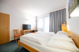 Postel nebo postele na pokoji v ubytování Parkhotel Hirschwang