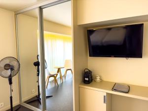 TV a/nebo společenská místnost v ubytování Villa Vindina
