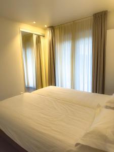 Postel nebo postele na pokoji v ubytování Villa Vindina