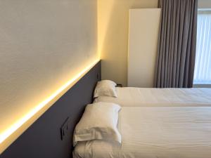 Postel nebo postele na pokoji v ubytování Villa Vindina