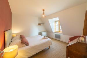 a bedroom with a white bed and a window at Happy Loft - Centre historique + parking privé in Blois