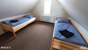 Postel nebo postele na pokoji v ubytování Apartmány Boule