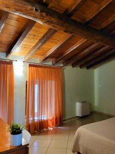 Postel nebo postele na pokoji v ubytování Hotel Federico II