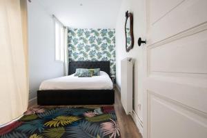 Posteľ alebo postele v izbe v ubytovaní HSH Traversière-Boulogne-Billancourt I Appartement 4P
