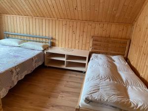 Postel nebo postele na pokoji v ubytování Kvasy 838