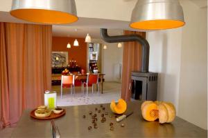 a kitchen with a counter top with a stove at Maison spacieuse avec piscine à Saint-Lager-Bressac in Saint-Lager-Bressac