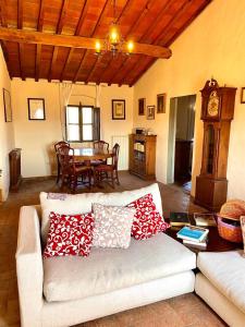 a living room with a couch and a table at Winery Houses in Chianti in Mercatale Val Di Pesa