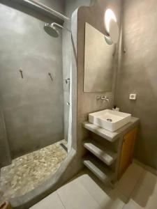 a bathroom with a sink and a shower at Athenian urban experience in Athens