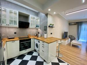 a kitchen with a sink and a dishwasher at Athenian urban experience in Athens