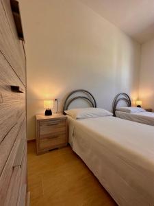 A bed or beds in a room at Residenza Vaccileddi