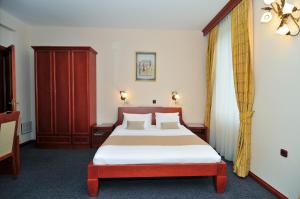 Postel nebo postele na pokoji v ubytování Hotel Montenegrino