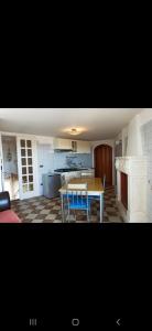 a kitchen and dining room with a table and chairs at B&B L'Antico Ortale in Carovigno