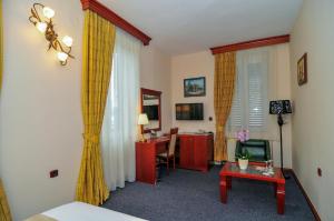 TV a/nebo společenská místnost v ubytování Hotel Montenegrino