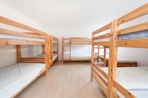 a group of bunk beds in a room at Sailing House Piran in Piran