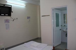 TV a/nebo společenská místnost v ubytování Ngoc Mai Guesthouse + 24 fotografií