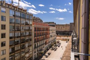a view of a street in a city with buildings at Le Angioine Rooms in Naples