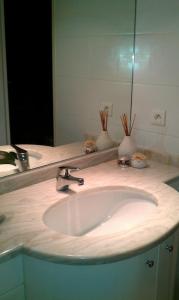 a bathroom counter with a sink and a mirror at Studio Residence Du Casino in Menton +7 photos